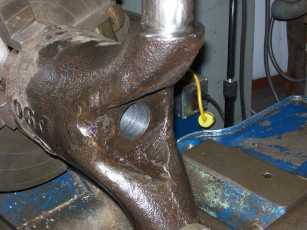 Horn mounted in lathe for drilling